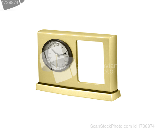 Image of golden table clock with photo frame