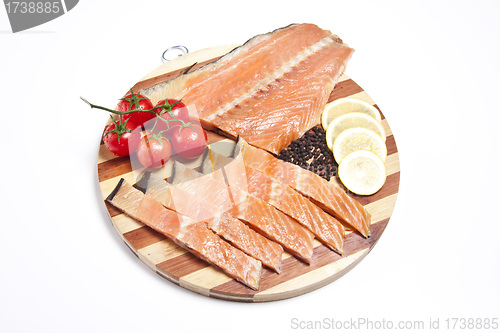 Image of fresh salmon on a cutting board isolated