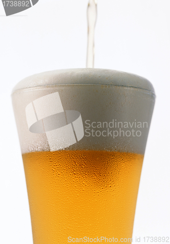 Image of Light beer poured in a glass isolated on a white