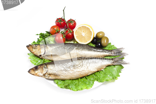 Image of Smoked sprat-appetizing snack with tomato and lemon