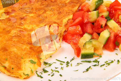 Image of Bacon omelet with vegetables close up