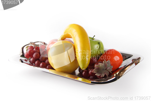Image of Selection of artificial fruit on plate