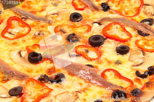 Image of Pizza with olives and fish background