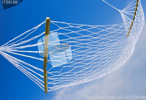 Image of view of nice white hammock on blue sky