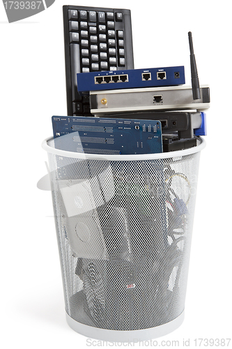 Image of electronic scrap in trash can