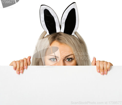 Image of A girl dressed as a rabbit with a poster