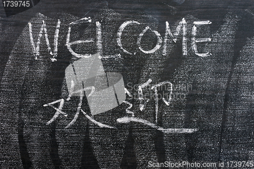 Image of Welcome - word written on a blackboard with a Chinese version