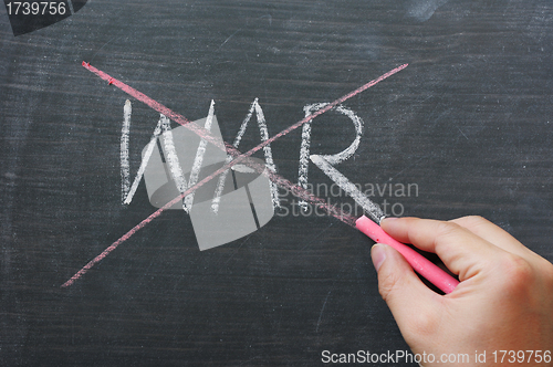 Image of War - word crossed out with red chalk 