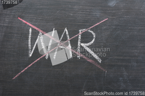 Image of War - word crossed out with red chalk 