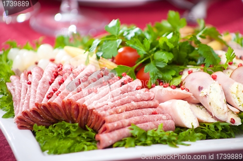 Image of cold appetizer with ham, cheese and fresh salad