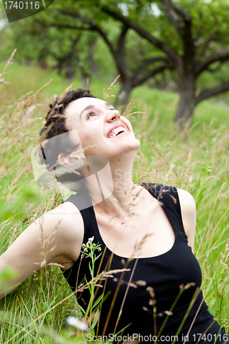 Image of  happy girl on green field 