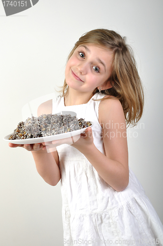 Image of Young girl with traditional European Christmas food kutia