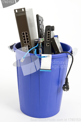 Image of electronic scrap in trash can
