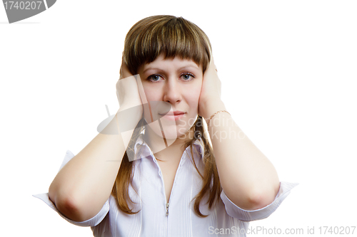 Image of young girl covers his ears with his hands