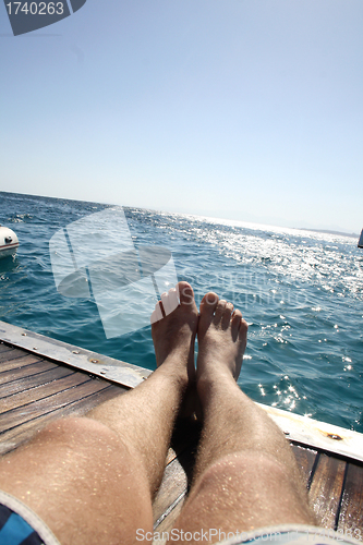 Image of lying on deck of yacht