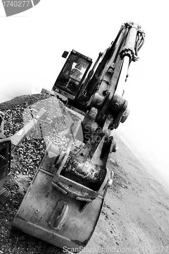 Image of backhoe digging bulk