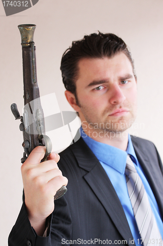 Image of Businessman with a handgun