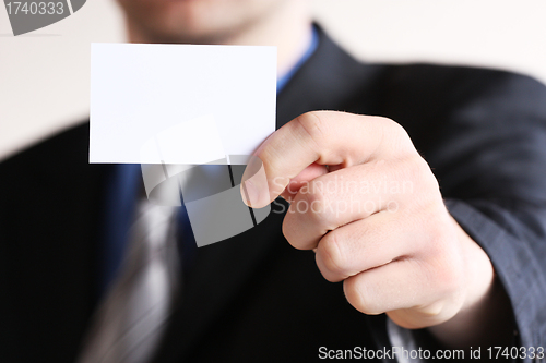 Image of Young businessman offering businesscard 