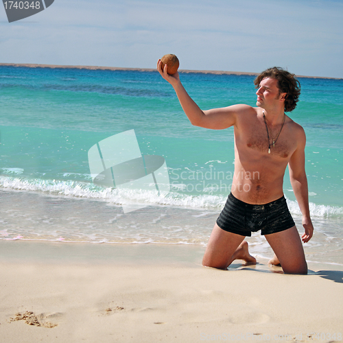Image of Man posing on beach