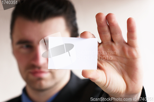 Image of businessman show blank card