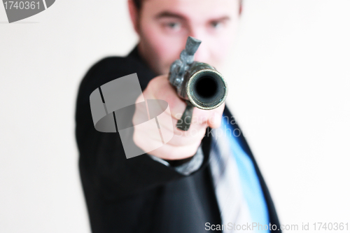 Image of business man with gun