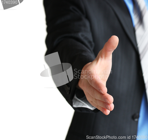 Image of A business man with an open hand in a welcome gesture