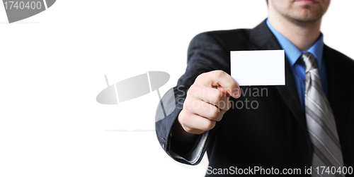 Image of man holding business card in hand