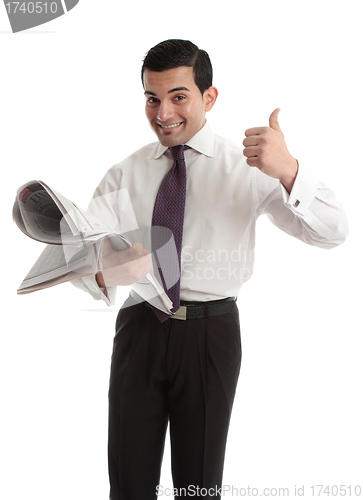 Image of Businessman stockbroker with newspaper thumbs up