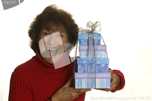 Image of happy woman with gifts stack