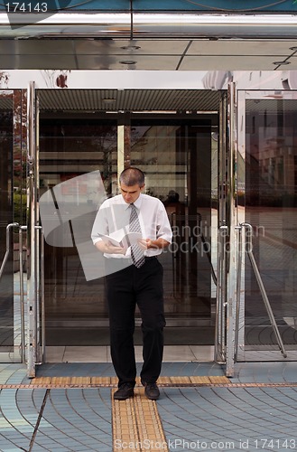 Image of Man With Notebook