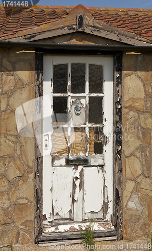 Image of Rotting wooden door