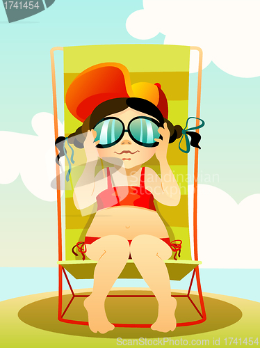 Image of Young girl in sunglasses on a beach