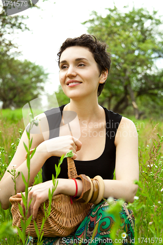 Image of woman with basket in the garden 