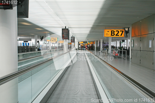 Image of AMSTERDAM - APRIL 14: Passengers move around the terminal at Ams