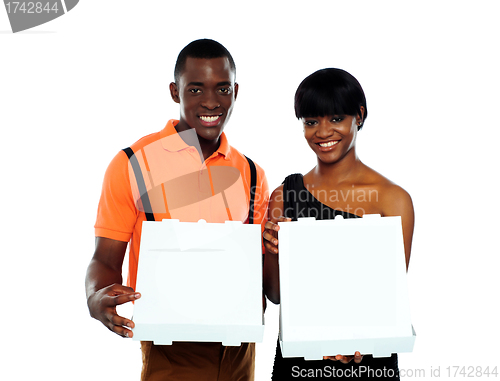 Image of Beautiful young couple with pizza boxes