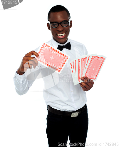 Image of Young black boy ready to show his trump card