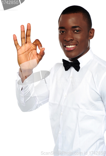 Image of Young african boy showing okay gesture