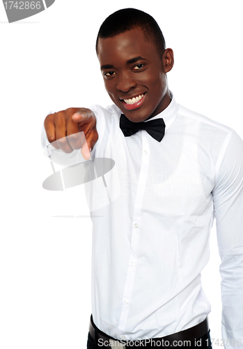 Image of African businessman pointing at you