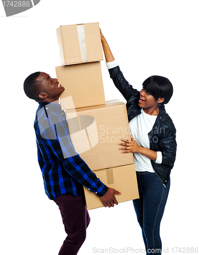 Image of Teenage couple with cardboard boxes