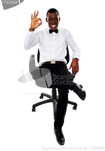 Image of African corporate man showing okay gesture