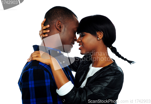 Image of Young female about to kiss her boyfriend
