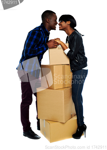 Image of Couple holding hands and about to kiss