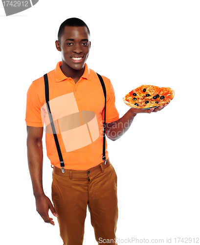 Image of Handsome black man holding pizza