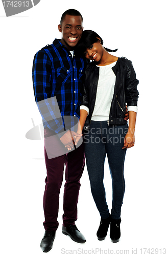 Image of African young couple holding hands