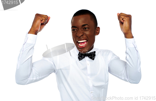 Image of Excited african man enjoying his success