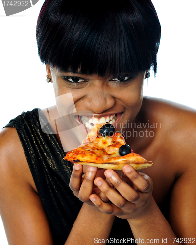 Image of Woman enjoying pie of a pizza