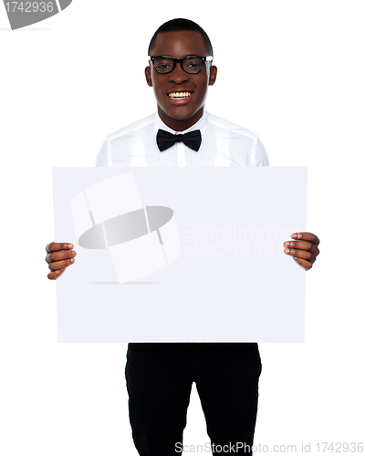 Image of Smiling business representative holding whiteboard