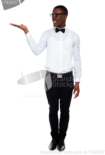 Image of Smiling isolated man presenting copyspace
