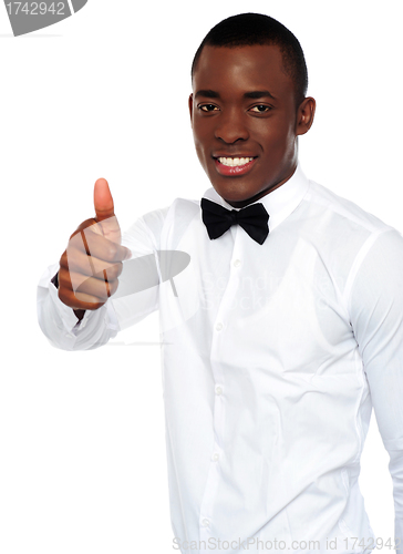 Image of African boy in party-wear gesturing thumbs-up