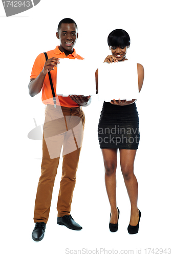 Image of Attractive african couple with pizza boxes